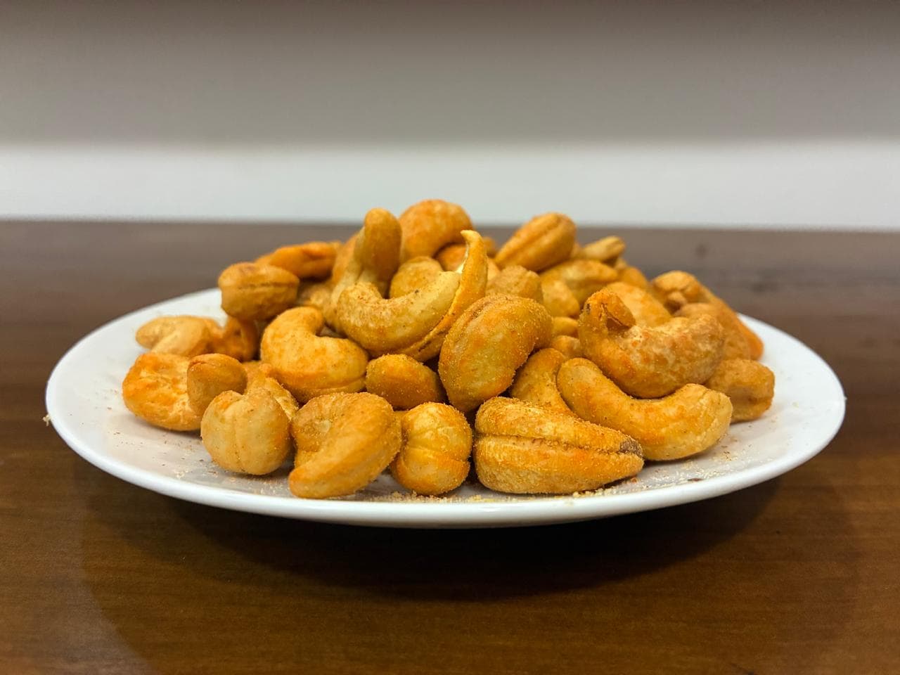 Spicy devilled cashew nuts coated in red chili seasoning